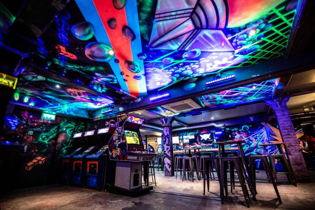 colourful retro bar with arcade games