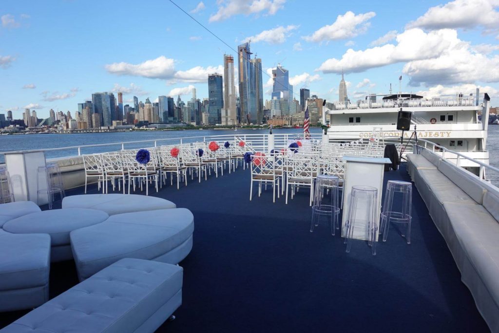 a deck of a yacht overlooking Manhattan