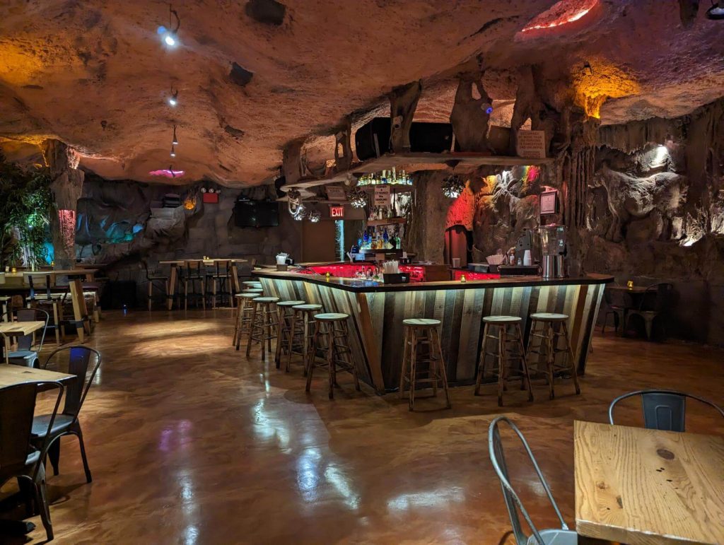 a bar area of a venue looking like an inside of a cave