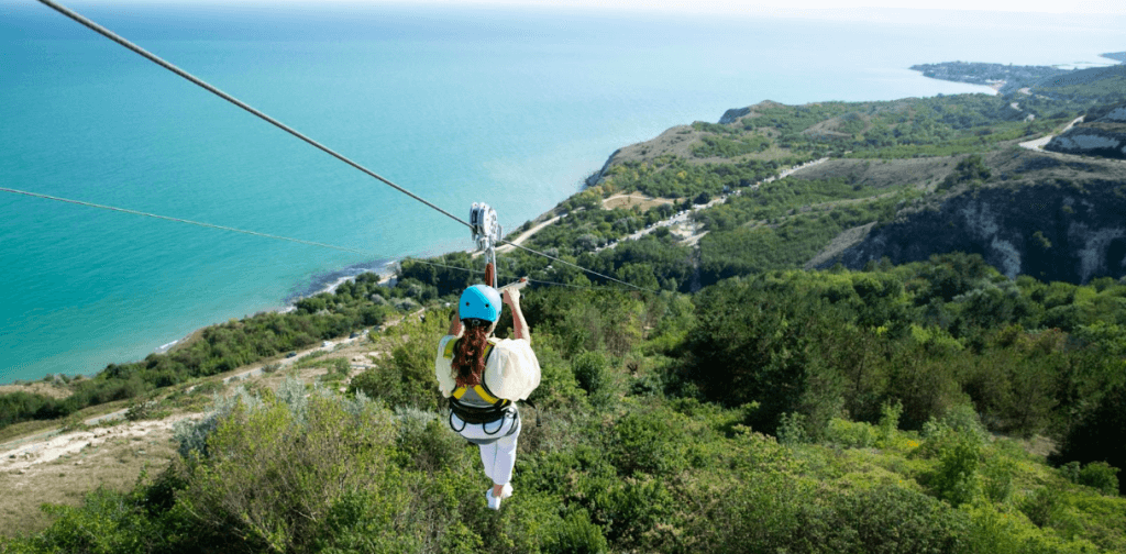 a woman ziplining bachelor party goals in Vegas